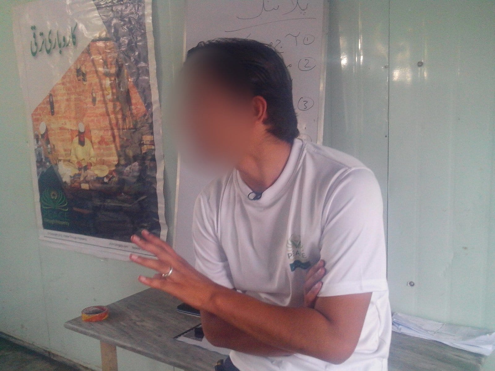 A participant at a Peace Through Prosperity mini-MBA class in Haripur, Khyber Pakhtunkhwa, 2013 (cohort 1, day 2). Face blurred.