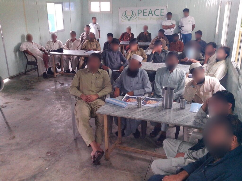 A Peace Through Prosperity mini-MBA class in Haripur, Khyber Pakhtunkhwa, 2013 (cohort 1, day 2). Faces blurred.