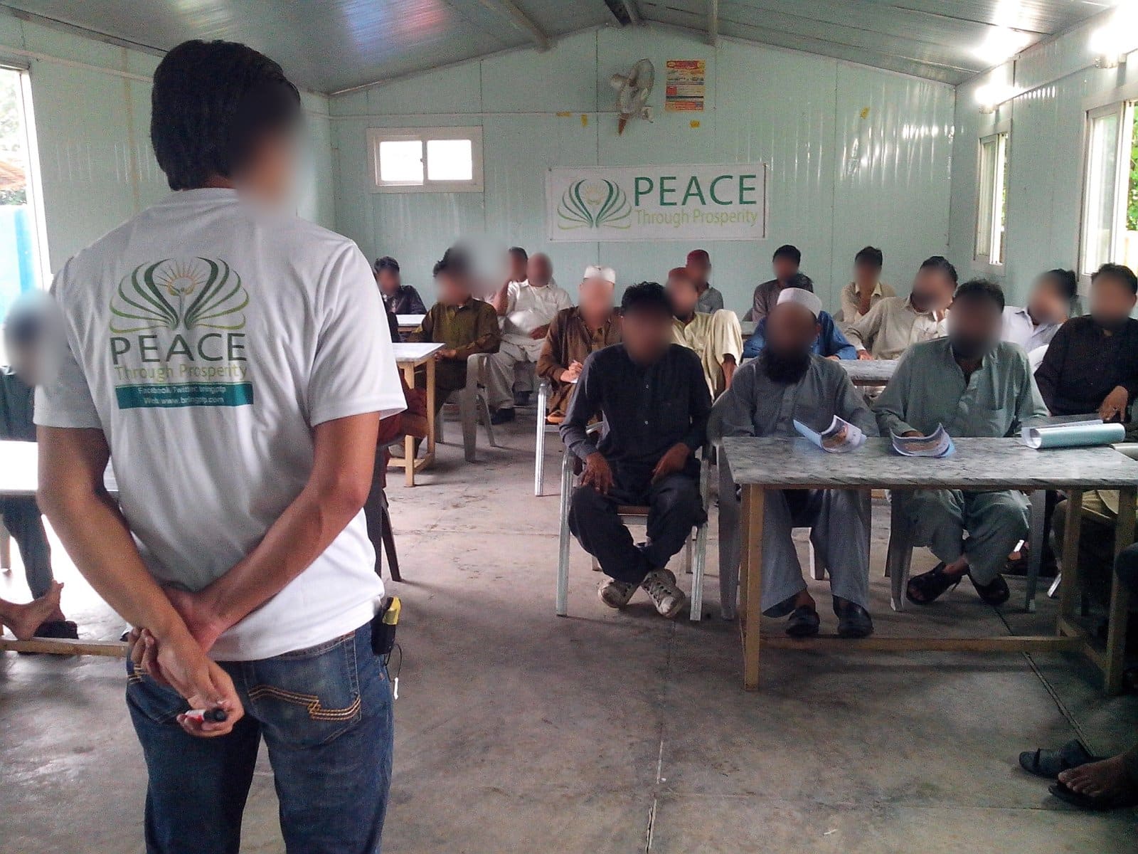 A Peace Through Prosperity mini-MBA class in Haripur, Khyber Pakhtunkhwa, 2013 (cohort 1, day 3). Faces blurred.