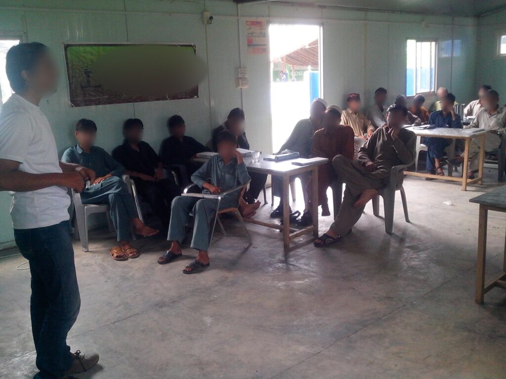 A Peace Through Prosperity mini-MBA class in Haripur, Khyber Pakhtunkhwa, 2013 (cohort 1, day 4). Faces blurred.